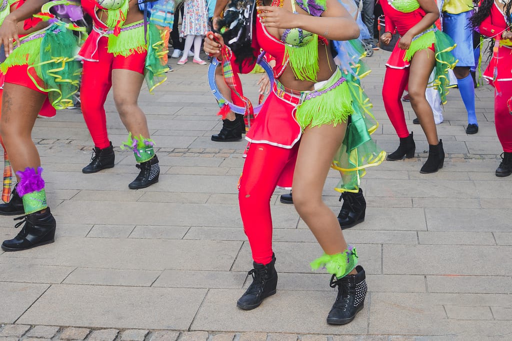 Caribbean women dancing in costumes at a Caribbean festival as a Must-See in Martinique