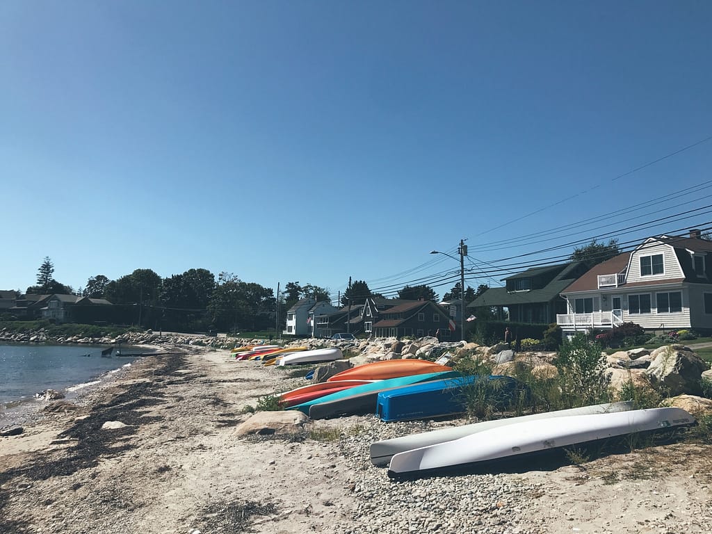 Top places to see in New England: Kayaks on a beach in Connecticut, USA